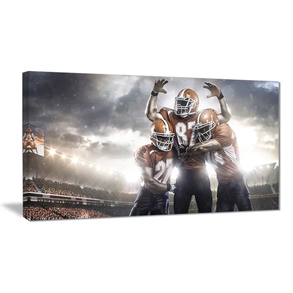 Designart 'American Football Players on Stadium' Sports Canvas Print 32 in. Wide x 16 in. High