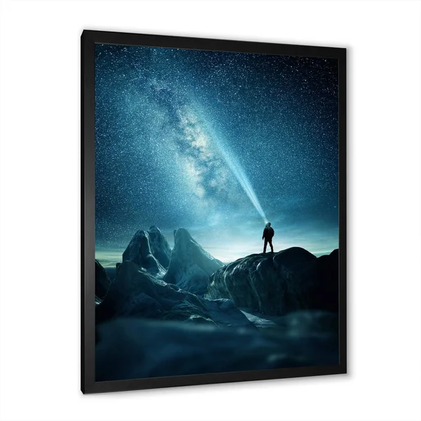 Designart 'A Man Shining A Light Into The Night Sky' Modern Framed Art Print - 30 in. Wide x 40 in. High - Black