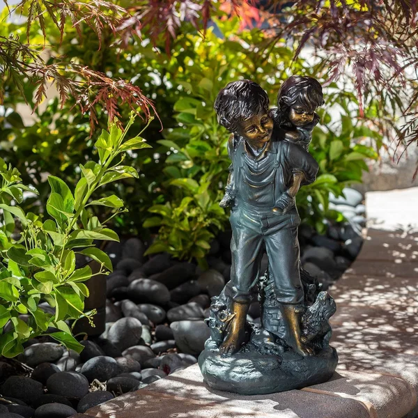 Alpine Boy Giving Piggyback Ride Statue