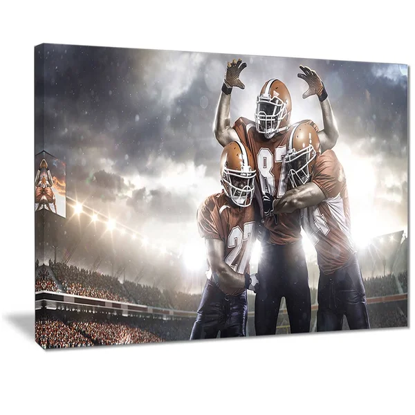 Designart 'American Football Players on Stadium' Sports Canvas Print 32 in. Wide x 16 in. High